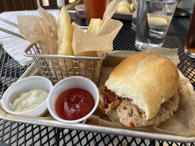 A+Brazilian+sausage+sandwich+with+yuca+fries+on+the+side